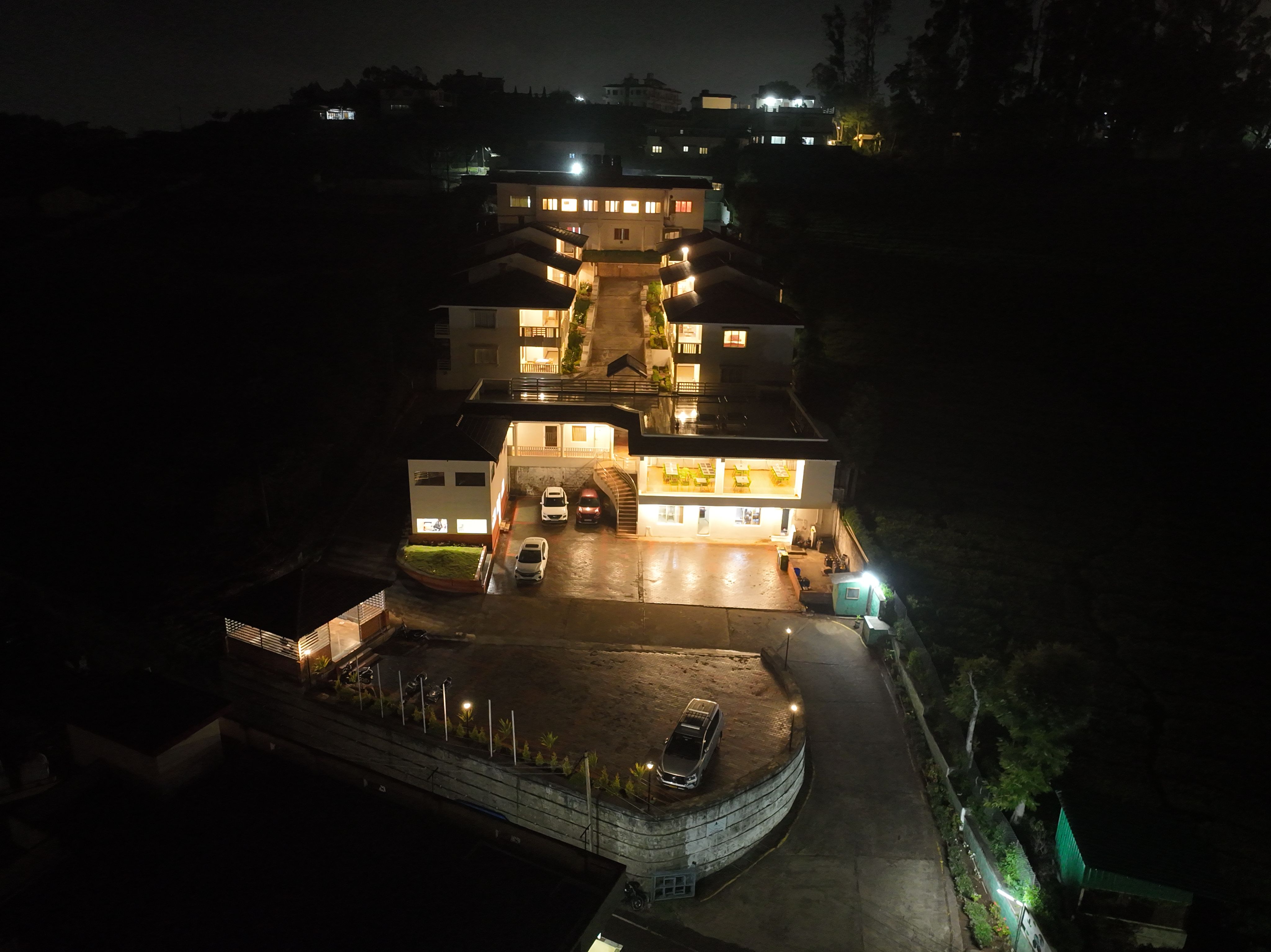 Aerial night view of Le Meadows Serenity resort in Ooty