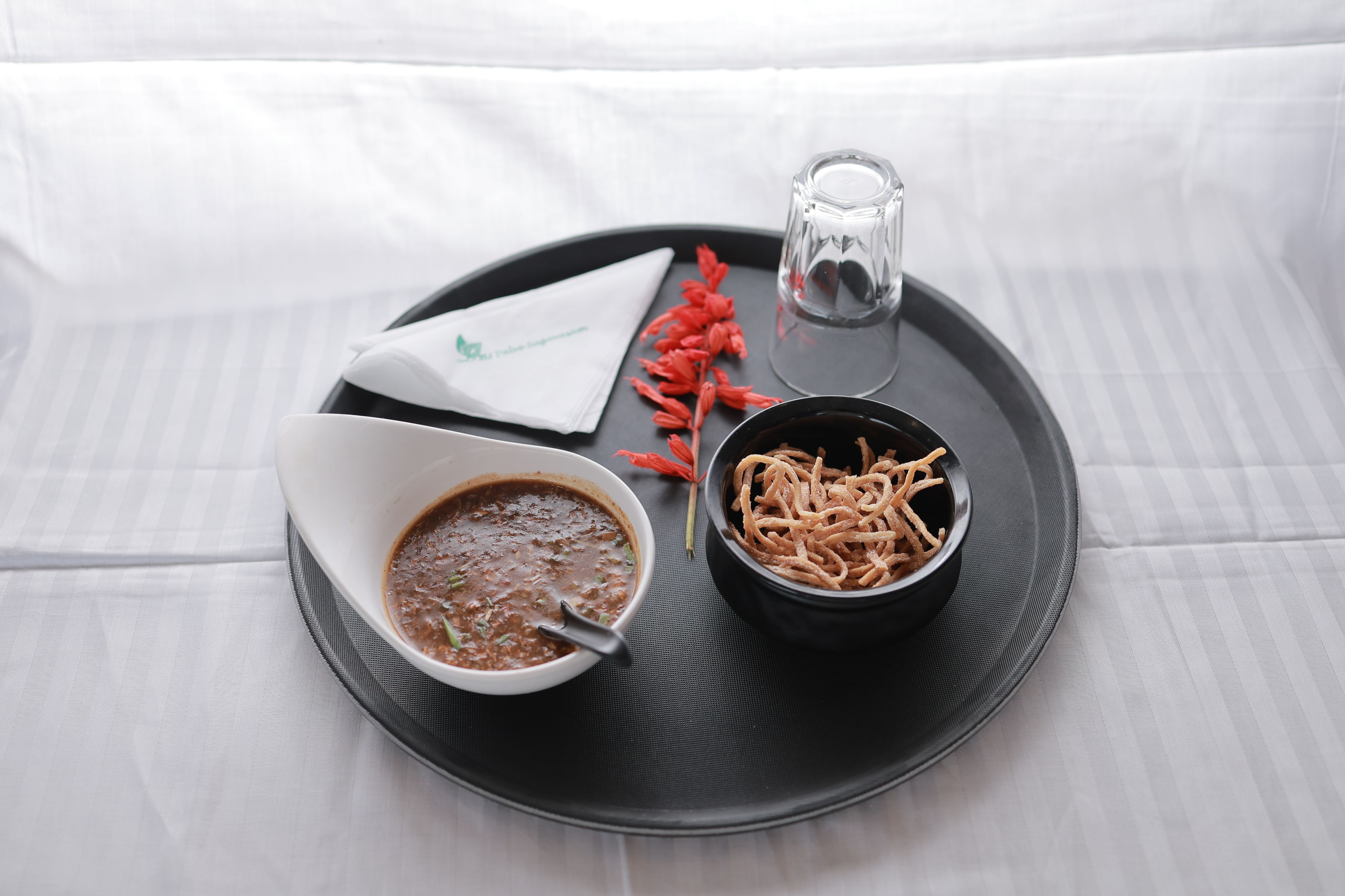 Freshly prepared hot soup served with crispy snacks at Le Meadows Serenity