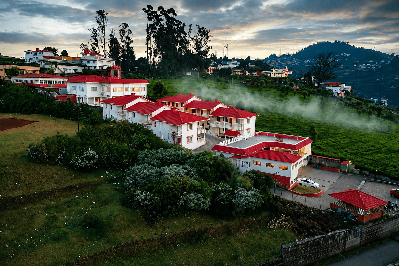 Aerial view of Le Meadows Serenity surrounded by Ooty hills and tea gardens