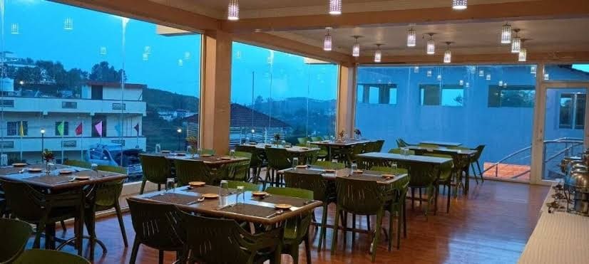 Fine dining restaurant in Ooty offering scenic mountain views, delicious cuisine, and a relaxing ambiance.